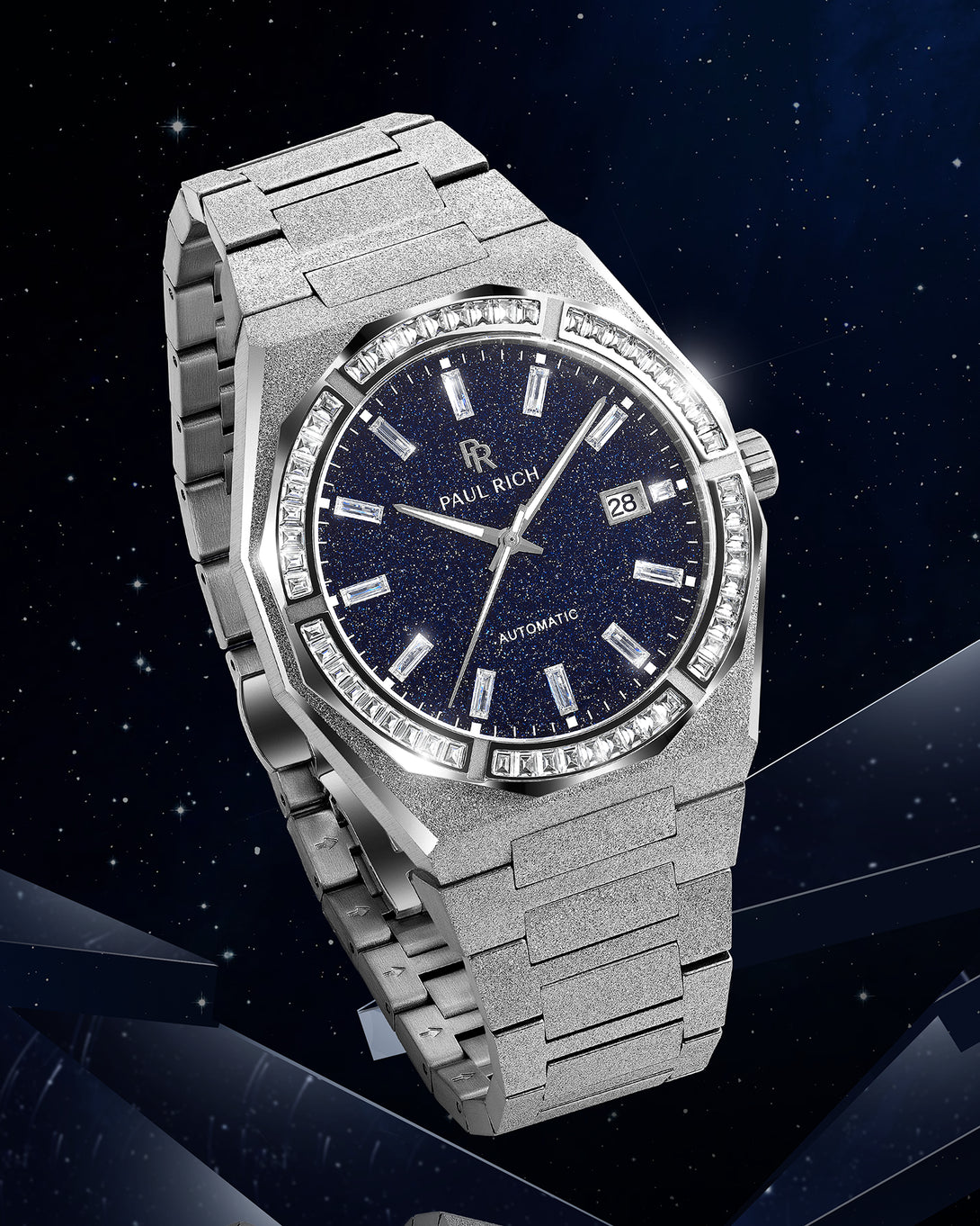 Silver frosted watch with blue aventurine dial and moissanite bezel displayed against a starry background with light reflections. Quartz | Automatic product_visual Silver frosted watch with blue aventurine dial and moissanite bezel displayed against a starry background with light reflections. Quartz | Automatic product_visual