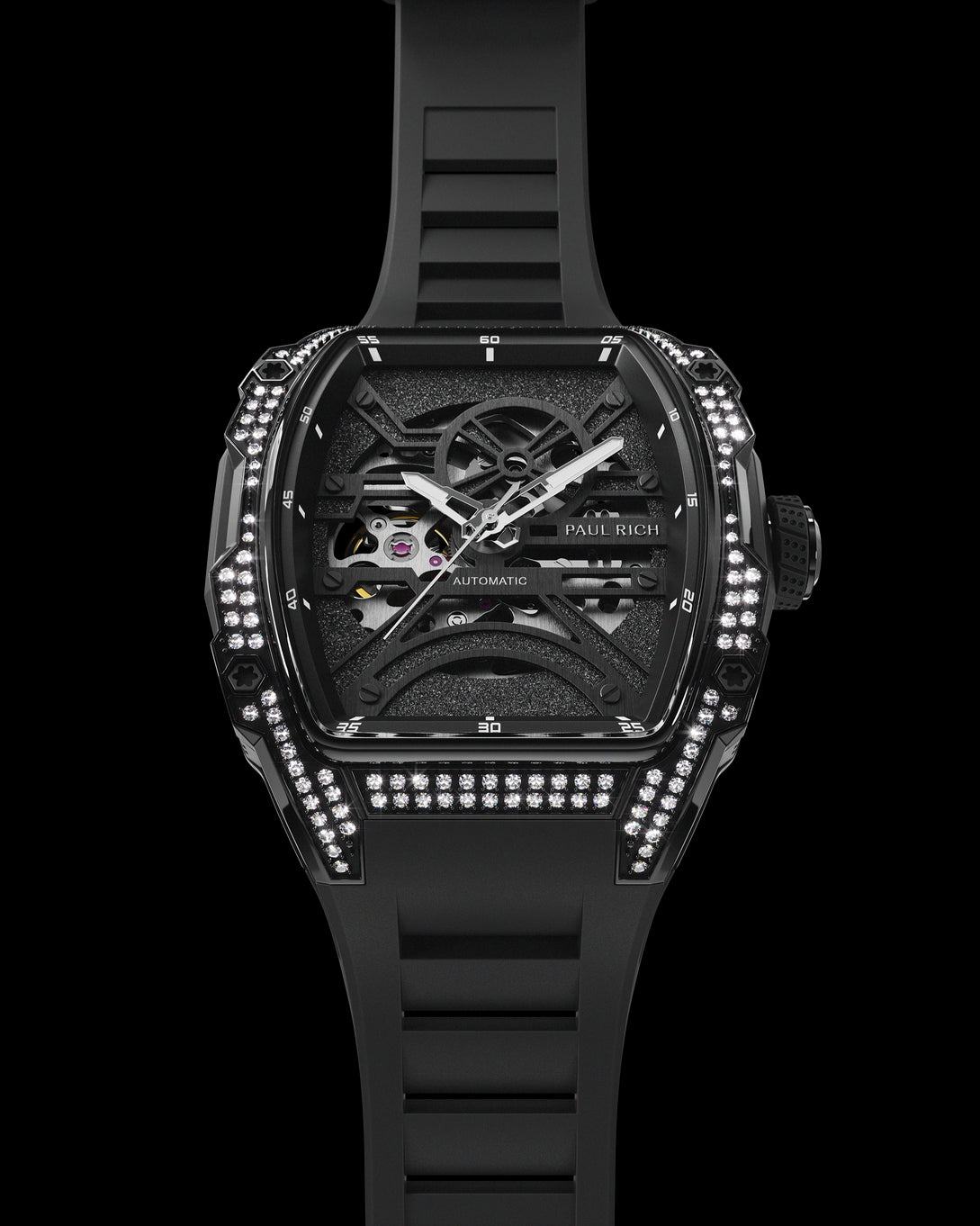 Angled view of black skeleton watch with diamond-set case and black strap, showing exposed movement on white background. Angled view of black skeleton watch with diamond-set case and black strap, showing exposed movement on white background.