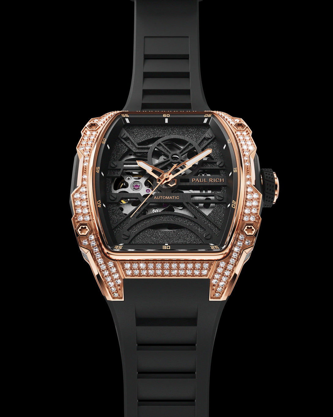 Luxury skeleton watch with rose gold and diamond case, black dial, and black strap shown on a white background. Luxury skeleton watch with rose gold and diamond case, black dial, and black strap shown on a white background.