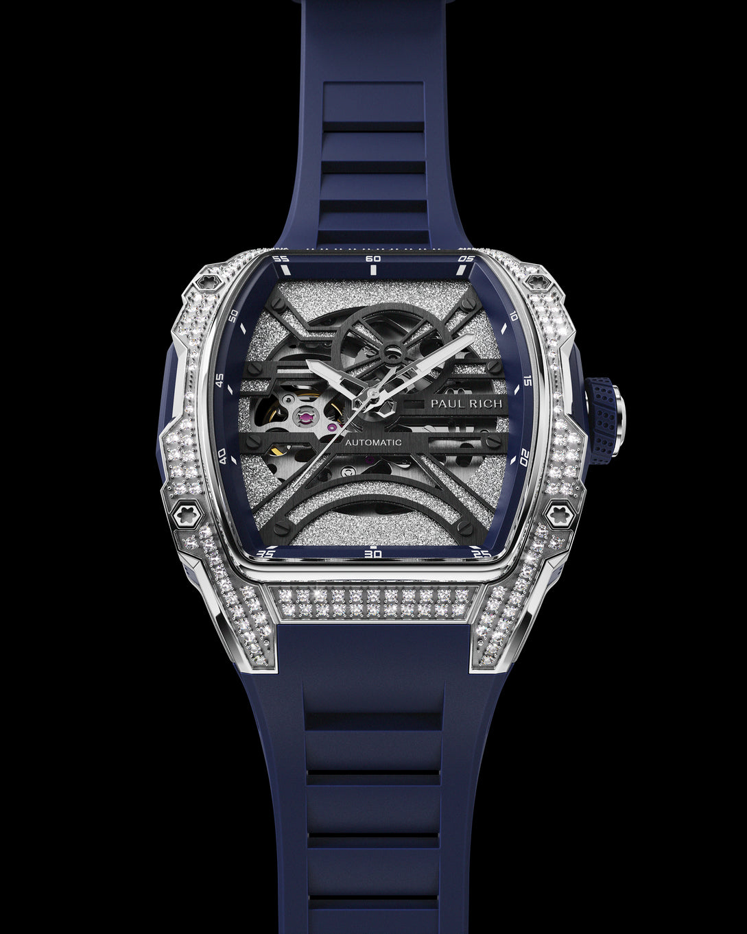 Front view of open dial watch with diamond-set silver case and navy blue strap, shown on transparent background. Front view of open dial watch with diamond-set silver case and navy blue strap, shown on transparent background.