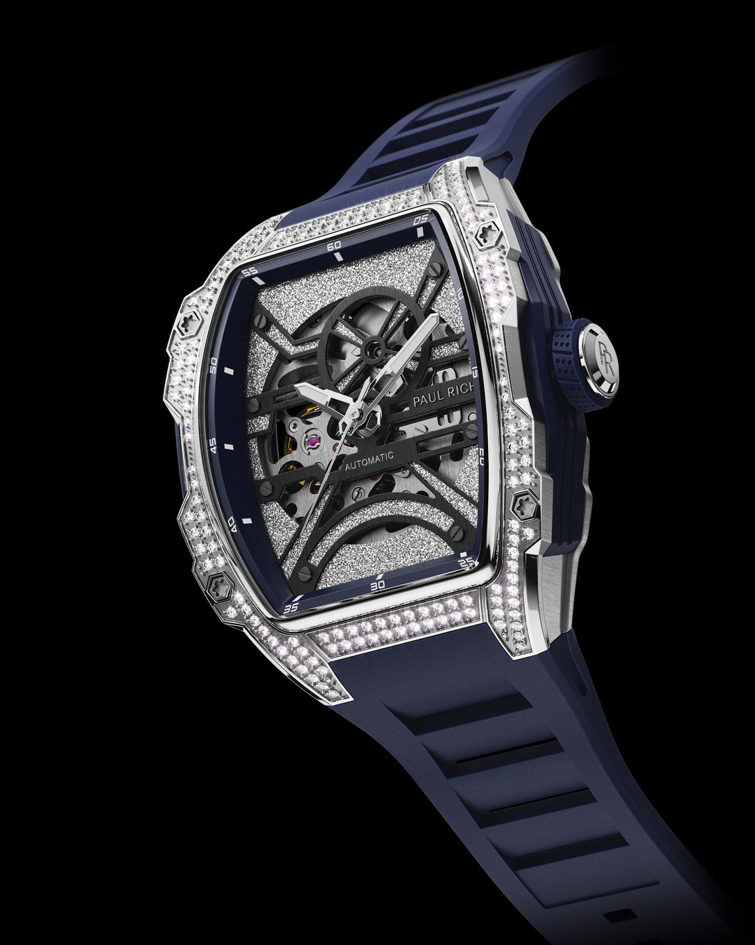 Angled view of open dial watch with diamond-set silver case and navy blue strap, shown on transparent background. Angled view of open dial watch with diamond-set silver case and navy blue strap, shown on transparent background.