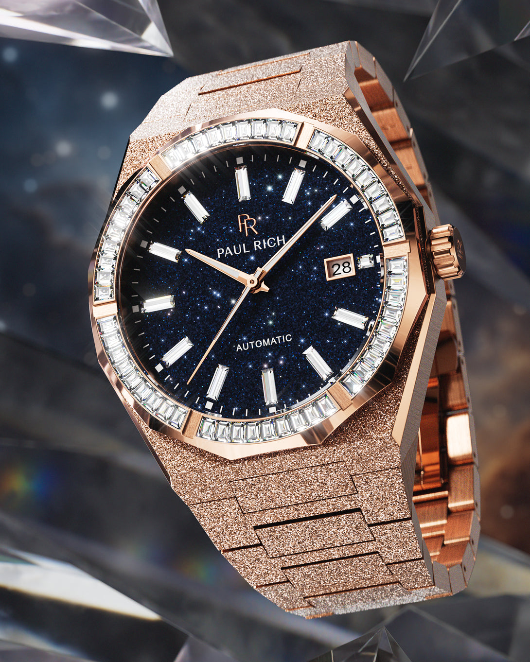 Rose gold automatic watch with a frosted case and bracelet, deep blue aventurine dial, and baguette-cut moissanite bezel displayed against a dark crystal-inspired cosmic background. product_visual Quartz I Automatic Rose gold automatic watch with a frosted case and bracelet, deep blue aventurine dial, and baguette-cut moissanite bezel displayed against a dark crystal-inspired cosmic background. product_visual Quartz I Automatic
