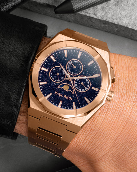 Brushed rose gold moonphase watch on wrist with aventurine dial, calendar subdials, and rose gold bracelet. product_visual, [lifestyle]