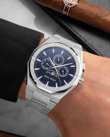 Frosted silver moonphase watch on wrist with aventurine dial, calendar subdials, and sparkling textured silver bracelet. product_visual, [lifestyle]