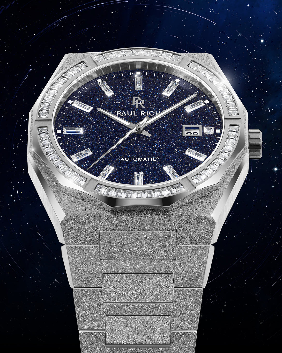 Silver frosted watch with blue aventurine dial, moissanite bezel, and date window at 3 o’clock displayed against a starry night background. Quartz | Automatic product_visual