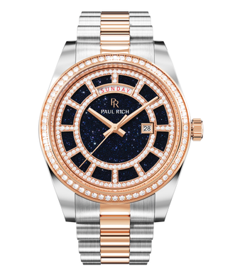 Two-tone silver and rose-gold watch with a blue aventurine dial, day and date windows, and a bezel and hour markers set with crystal stones.