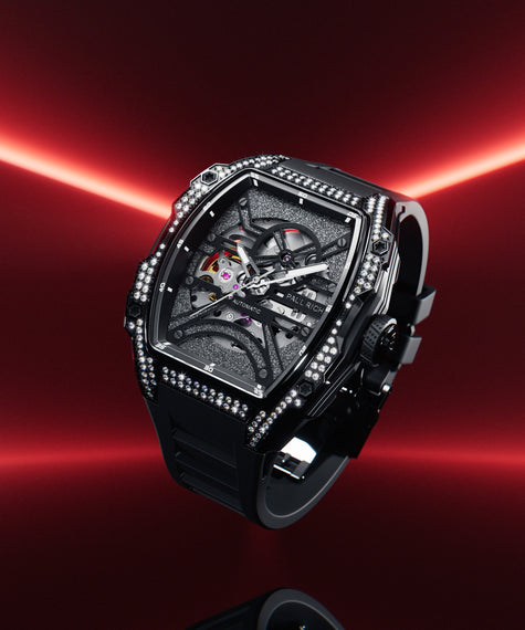 Black open dial watch with diamond-set case and strap, shown floating against a red gradient background with glowing light beams. product_visual, [lifestyle]