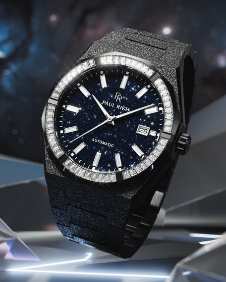 Black Paul Rich watch with frosted texture, blue aventurine dial, and gem-set bezel, displayed against a cosmic-inspired background. product_visual, [lifestyle]