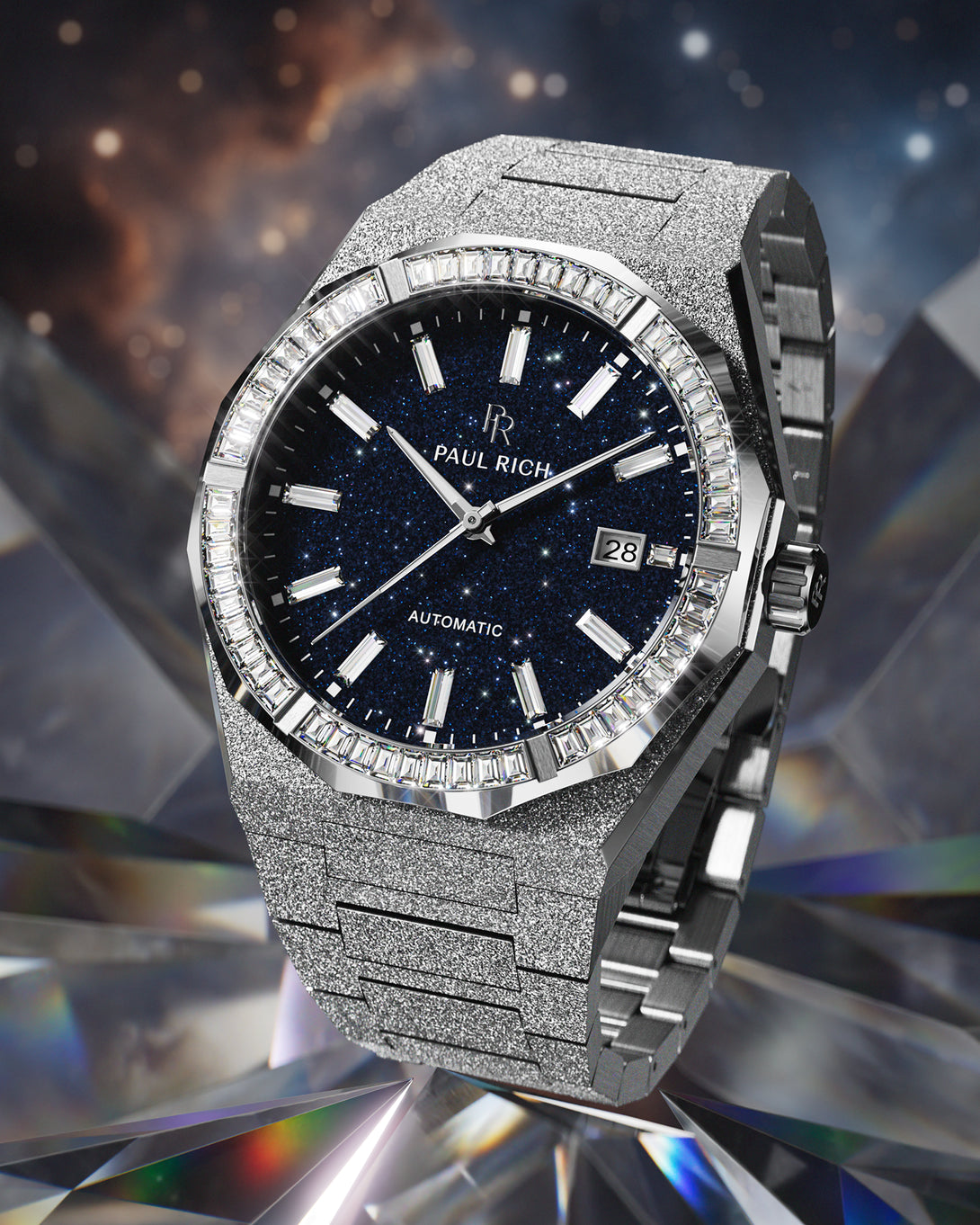 Silver automatic watch with a frosted case and bracelet, blue aventurine dial, and baguette-cut moissanite bezel set against a cosmic crystal background. product_visual, Quartz I Automatic