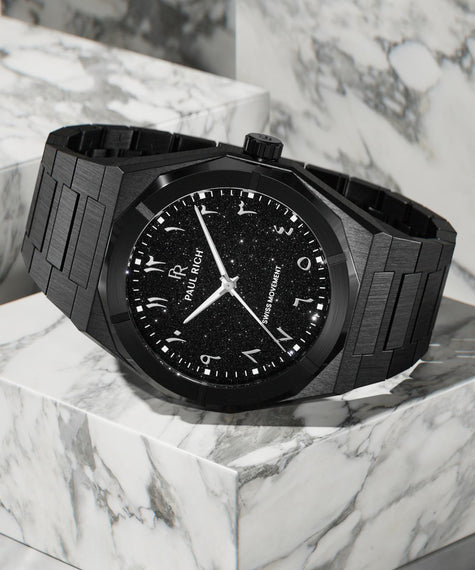 Paul Rich black brushed watch with black aventurine dial, silver Eastern Arabic numerals, and Swiss movement on black bracelet. product_visual, [lifestyle]