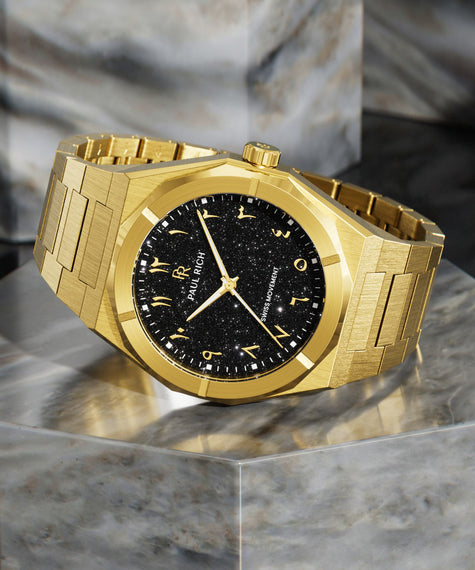 Paul Rich gold brushed watch with black aventurine dial, gold Eastern Arabic numerals, and Swiss movement on gold bracelet. product_visual, [lifestyle]