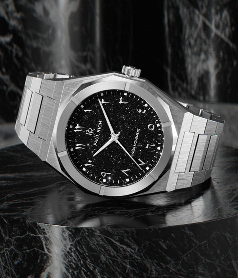 Paul Rich brushed steel watch with black aventurine dial, silver Eastern Arabic numerals, and Swiss movement on steel bracelet. product_visual, [lifestyle]