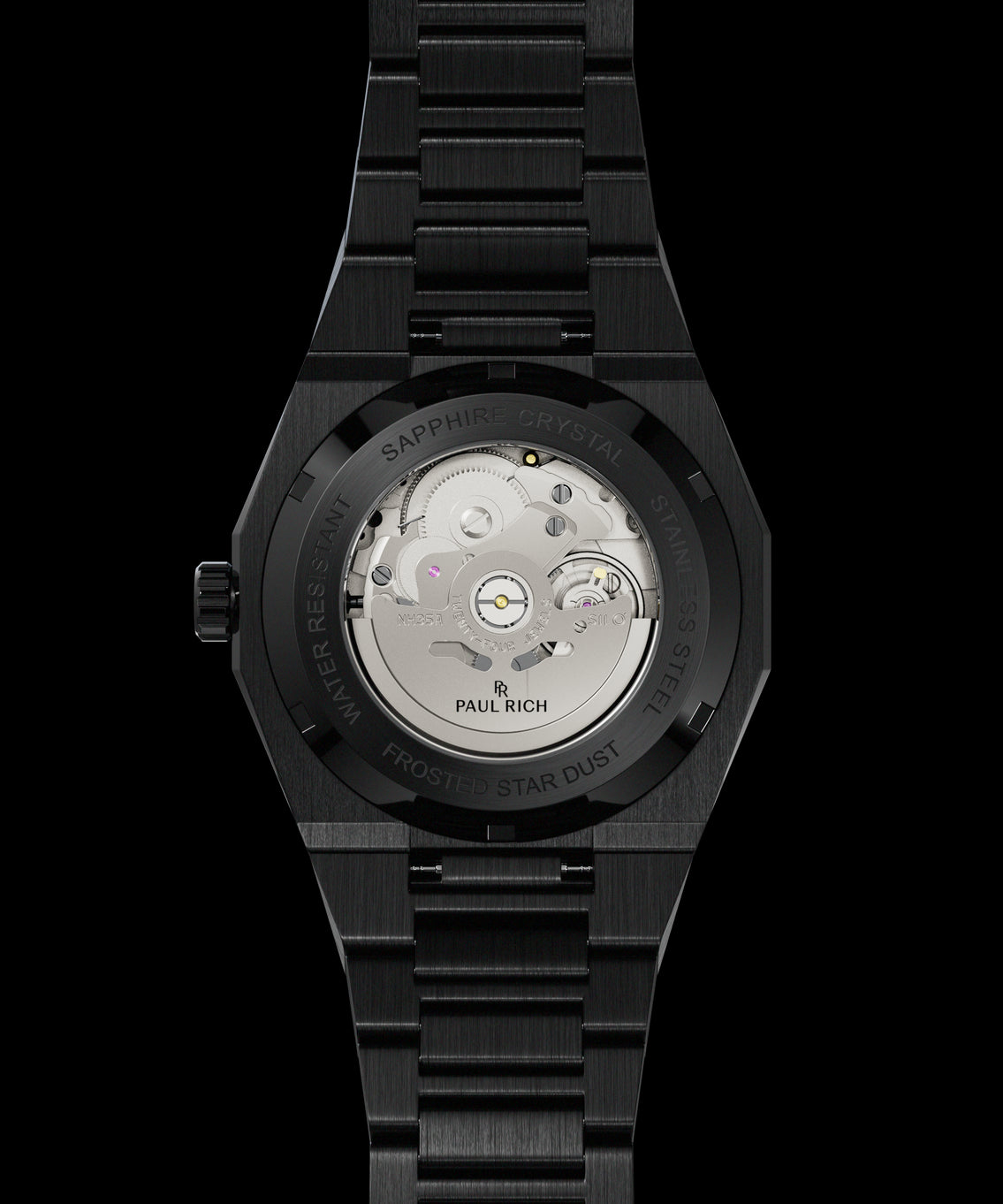 Back view of a black watch showing the automatic movement through a sapphire crystal case back engraved with “Frosted Star Dust.” Quartz | Automatic