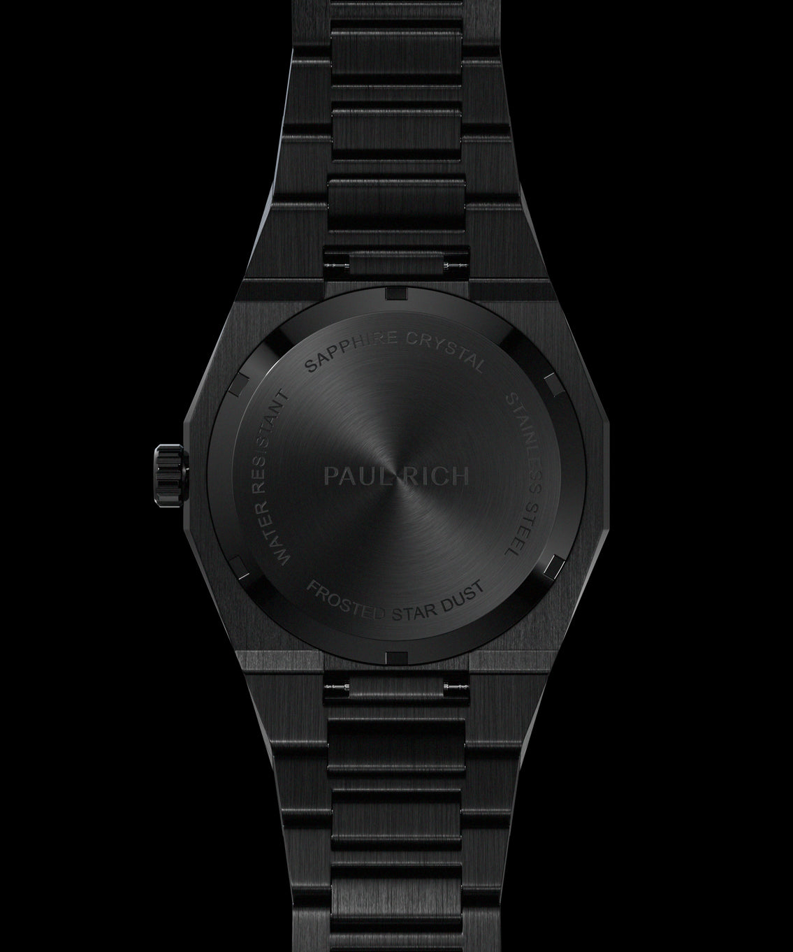 Back view of a black watch showing engraved case back with “Paul Rich,” “Frosted Star Dust,” and “Sapphire Crystal Stainless Steel.” Quartz