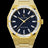 Gold frosted watch with blue aventurine dial and trapezoid-cut moissanite bezel reflecting light in sharp, diamond-like flashes. Quartz