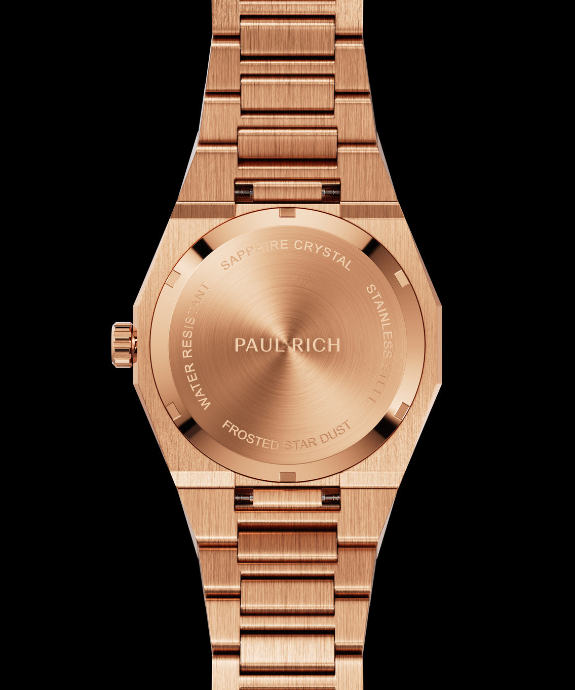 Rose gold frosted watch case back with transparent sapphire window showing automatic movement gears and engraved outer markings. Quartz