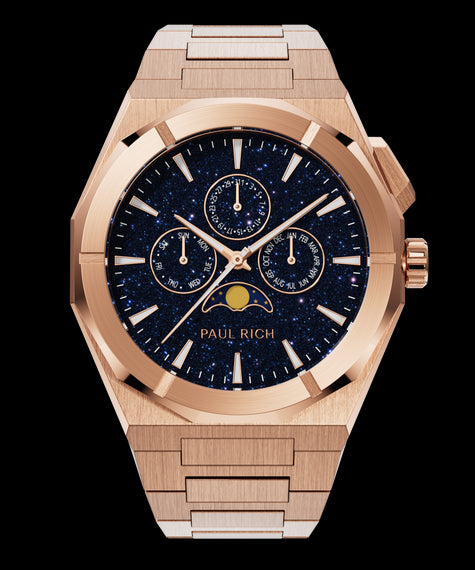 Paul Rich rose gold watch with blue aventurine dial, moonphase display, and three subdials on a brushed bracelet.