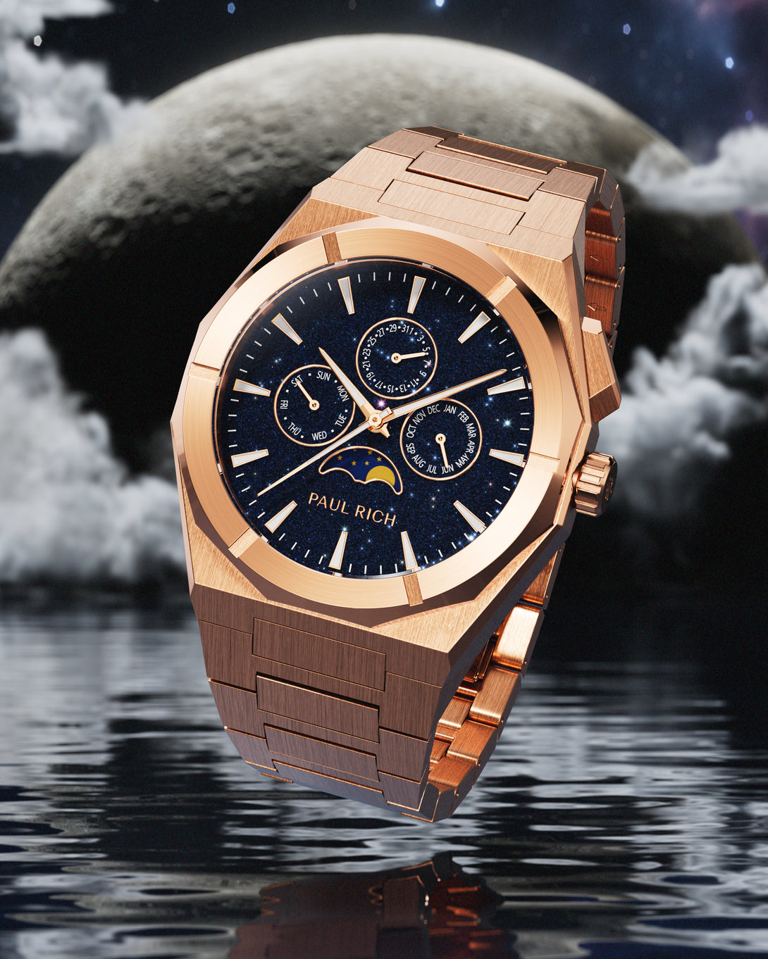 Brushed rose gold stainless steel watch with blue aventurine dial, moonphase, and subdials, set against a moonlit sky with clouds over water. product_visual